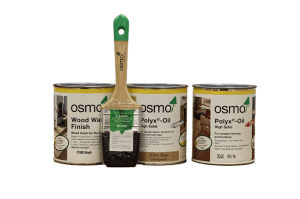 Three cans of Osmo wood finish products with a paintbrush, showcasing options for timber floor coatings.